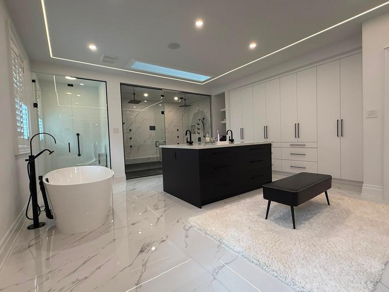 Renovated master ensuite with freestanding tub, black double vanity and glass shower in Richmond Hill