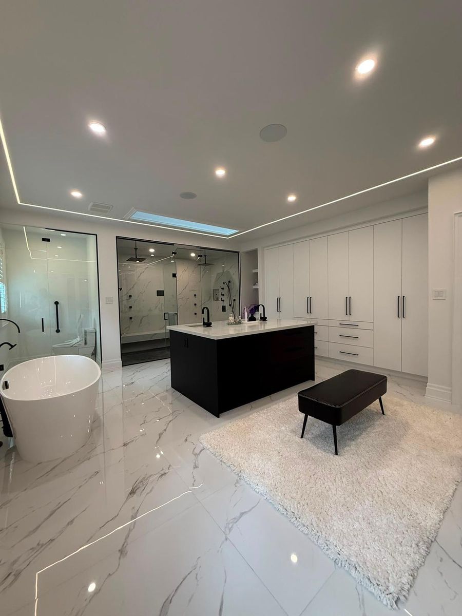 Renovated master ensuite by PerfectBuild with freestanding tub, glass shower and custom vanity